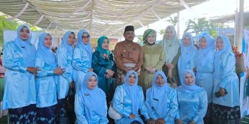 Anggun Berbusana Adat, Bupati Tanjab Barat dan Istri Mempesona di Hari Adat Melayu Jambi ke-747