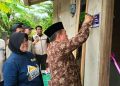Gubernur Al Haris Serahkan Bantuan Bedah Rumah di Merangin