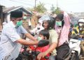 Bupati Anwar Sadat Bagikan Masker, Lindungi Warga di Tengah Kabut Asap